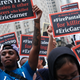 People participate in a protest to mark the five year anniversary of the death of Eric Garner during a confrontation with a police officer in the borough of Staten Island on July 17, 2019 in New York City.